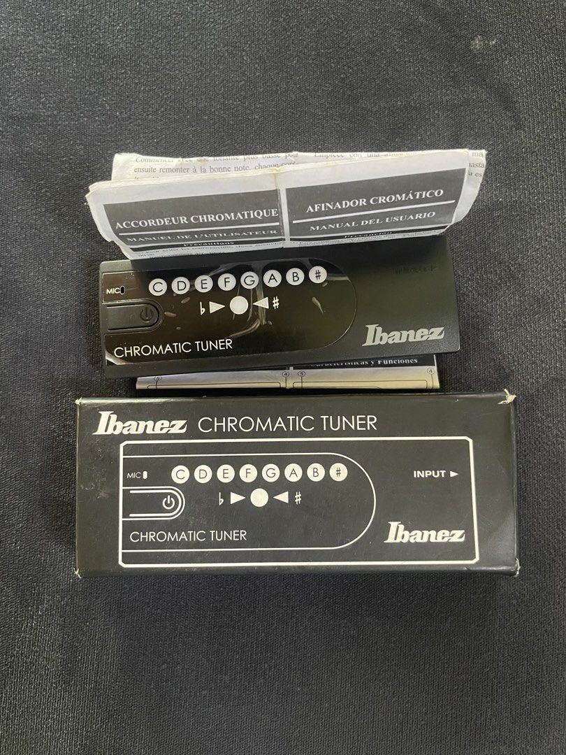 Ibanez Chromatic Tuner (Category: Other Audio Equipment) located in Laguindingan. Submitted by kixseven (Listing ID 1431224911, Image 1). Description: Ibanez Chromatic Tuner. Includes the tuner itself, and the original box and manual. Features a microphone input and a chromatic tuning display. The tuner has buttons for C, D, E, F, G, A, and B notes, as well as a sharp (#) button. The box also indicates the tuner has multiple functions. Location :