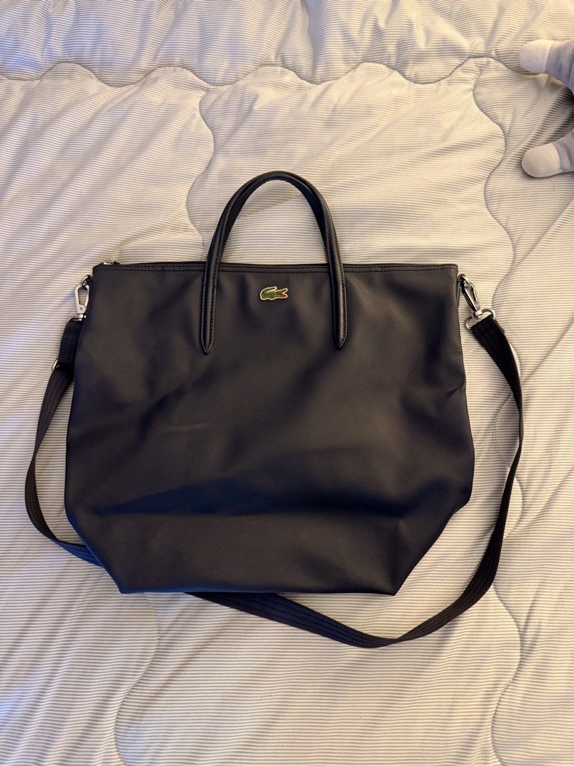 Lacoste sling bag (Category: Cross-body Bags) located in Manila. Submitted by flywithmigs21 (Listing ID 1431223346, Image 1). Description: Item was stored in the closet and currently decluttering Issue: Logo is a little bit dirty.