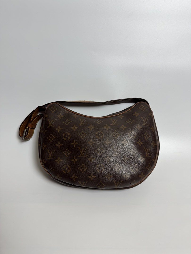 Louis Vuitton Monogram Croissant Bag (Category: Luxury Bags & Wallets) located in Cavite. Submitted by loadeadgears (Listing ID 1431341105, Image 1). Description: - Louis Vuitton shoulder bag - Classic Monogram canvas - Brown leather strap with buckle - Red fabric interior lining - Interior pocket - Gold-tone zipper pull - Made in France.