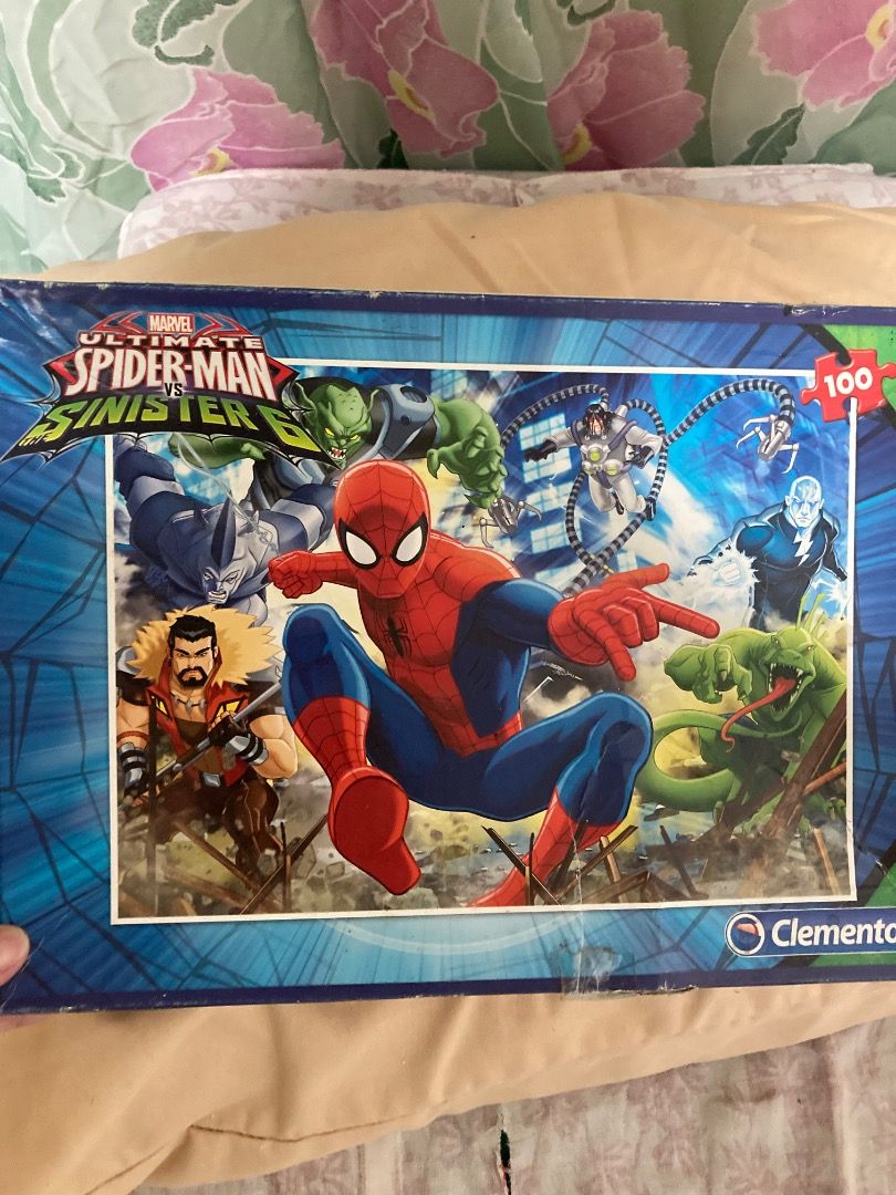 Marvel Jigsaw Puzzle (Category: Board Games & Puzzles) located in Valenzuela. Submitted by theaveqc04360 (Listing ID 1431271347, Image 1). Description: This item is a Clementoni Marvel Ultimate Spider-Man vs. The Sinister Six jigsaw puzzle. Number of Pieces: 100. Theme: Action scene featuring Spider-Man fighting the Sinister Six villains. Dimensions: Approximately \(48.5\times 33.5\text{\ cm}\). Recommended Age: 6 years and up..