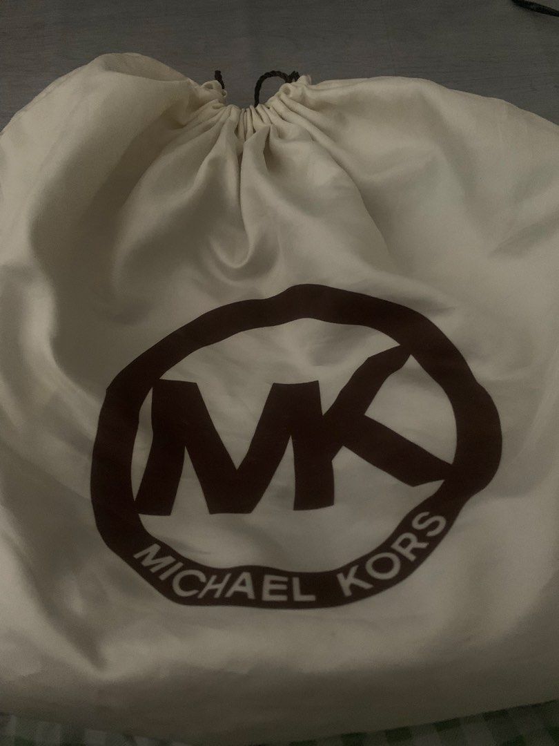 Michael Kors Leather Hobo Bag (Category: Luxury Bags & Wallets) located in Cavite. Submitted by sjcat (Listing ID 1423972818, Image 3). Description: - SELLING LOW, just need funds Authentic Michael Kors hobo bag - Crafted from genuine brown leather - Spacious main compartment with zipper closure - Two exterior pockets with zipper closures - Signature MK logo charm - Comfortable shoulder strap - Elegant gold-tone hardware.