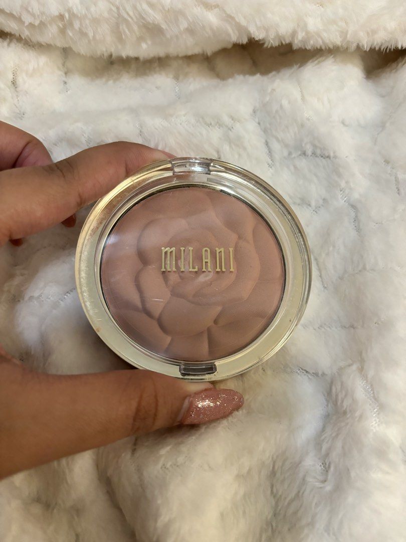 Milani Romantic Rose Powder Blush (Category: Makeup) located in Taguig. Submitted by hisandhers16 (Listing ID 1431346585, Image 1). Description: Authentic. Good as new. Swatched only. See pics. - Milani Romantic Rose Powder Blush in shade 01 - Features a beautiful rose design - Housed in a round compact with a clear lid - Warm, neutral tone - Product details (ingredients, weight) are on the back.
