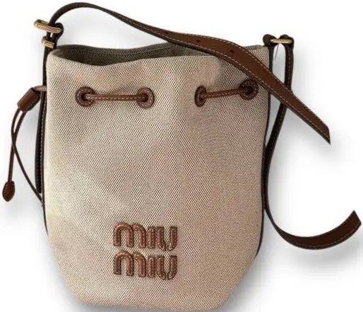 Miu Miu Canvas Bucket Bag (Category: Beach Bags) located in Paranaque City. Submitted by rbpar (Listing ID 1431350021, Image 1). Description: Impulse buy on Carousell .