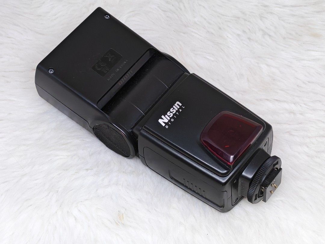 Nissin Di622 Digital Flash for nikon (Category: Flashes) located in Manila. Submitted by ultimogizmos (Listing ID 1431230920, Image 1). Description: - Nissin Di622 flash unit - Compatible with Nikon i-TTL digital cameras - Features: - Power level indicator - Mode selection - TTL power settings - Includes a red filter - Hot shoe mount for easy attachment.