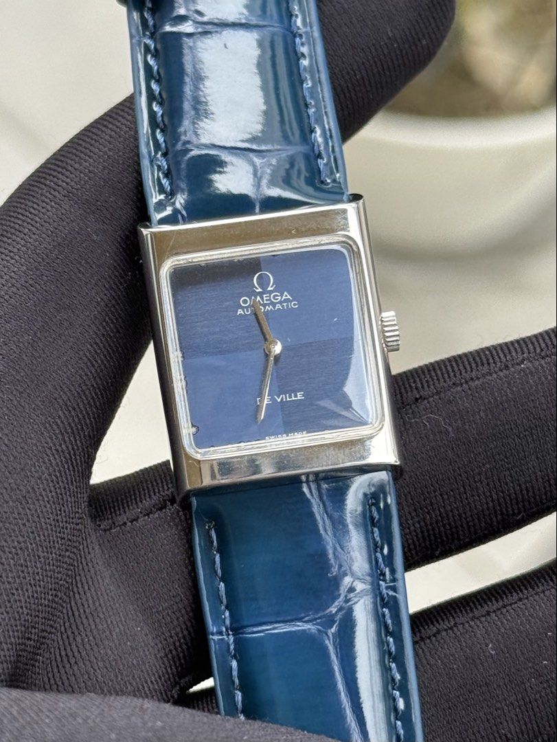 Omega De Ville Tank (Category: Luxury Watches) located in Quezon City. Submitted by mjgorobat15 (Listing ID 1431206277, Image 2). Description: Omega De Ville Tank •Reference no. ST 511.0427 •Year production 1972-1975 •Movement: Manual Wind Caliber 620 •Case: Stainless steel •Case size: 23mm •Blue checkered dial •Service History: February 2026 •Bracelet: New AM genuine leather •Inclusions: Watch and presentation box only •Condition: 9/10.