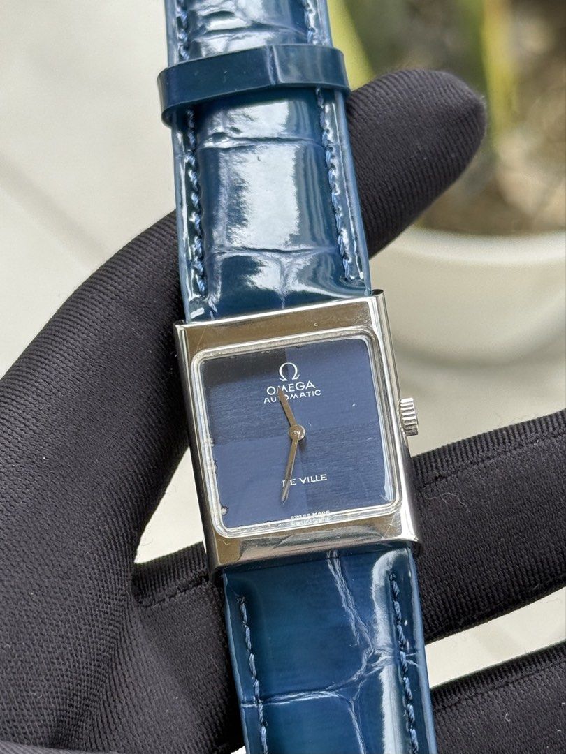 Omega De Ville Tank (Category: Luxury Watches) located in Quezon City. Submitted by mjgorobat15 (Listing ID 1431206277, Image 1). Description: Omega De Ville Tank •Reference no. ST 511.0427 •Year production 1972-1975 •Movement: Manual Wind Caliber 620 •Case: Stainless steel •Case size: 23mm •Blue checkered dial •Service History: February 2026 •Bracelet: New AM genuine leather •Inclusions: Watch and presentation box only •Condition: 9/10.