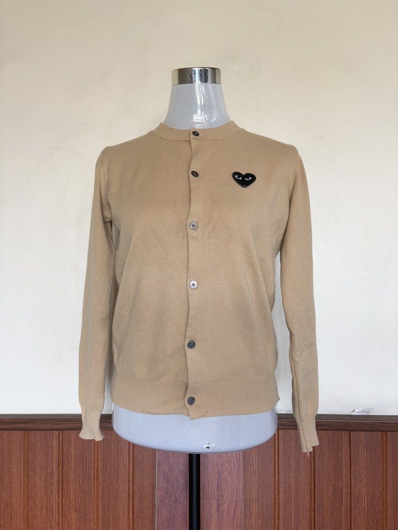 Play Comme des Garcons Khaki Knit Cardigan (Category: Longsleeves) located in Cebu City. Submitted by stylingtrends.coll (Listing ID 1431204558, Image 3). Description: •khaki •knitted •front button fastening •logo patch at the chest •long sleeves •ribbed cuffs and hem.