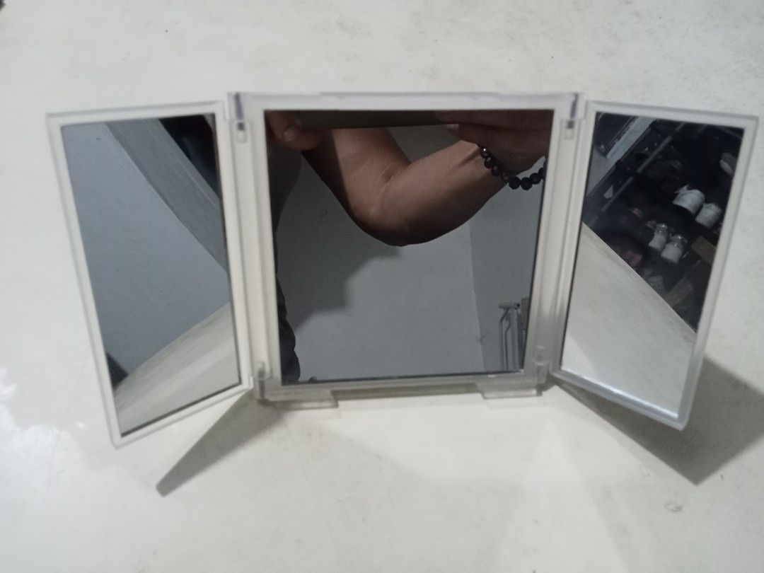 Pola Tri-Fold Mirror (Category: Mirrors) located in Bocaue. Submitted by marajapansurplus (Listing ID 1431294805, Image 2). Description: - Pola tri-fold mirror - Clear plastic frame and stand - Folds open and closed - Compact size, ideal for travel - Provides a clear reflection.