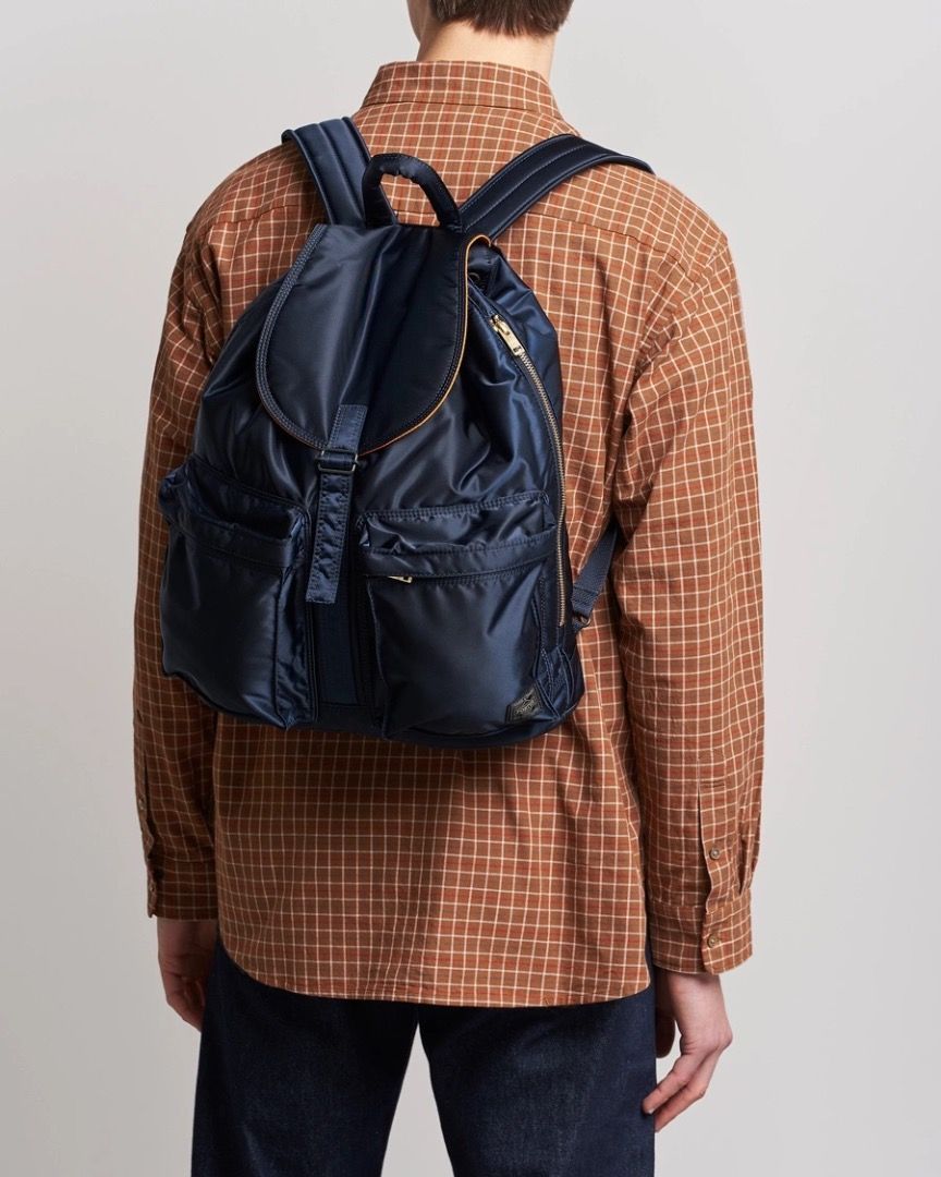 Head Porter Yoshida & Co. Tanker Rucksack (Category: Backpacks) located in Antipolo. Submitted by bentakahitanoano (Listing ID 1431280509, Image 3). Description: Porter Yoshida & Co. Tanker Rucksack Iconic Japan-made piece MA-1 inspired / orange lining Still very usable Flaws: rusty hardware - needs polish, velcro rip on pocket, broken inside and outside zipper pull - needs replacement.