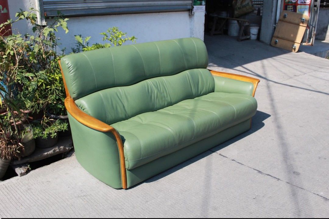 Sofa (Category: Sofas) located in Meycauayan. Submitted by marygracecasimiro (Listing ID 1431309677, Image 3). Description: 3-Seater Leather Sofa Solid wood frame and leather seat. Curved wooden armrests and a stylish look. Ergonomic semi-bucket backrest that is comfortable and supportive, ideal for everyday use and long sitting L: 73 • W: 33 • Seat H: 16 • Back H: 34 inches 20,900 pesos only💚.