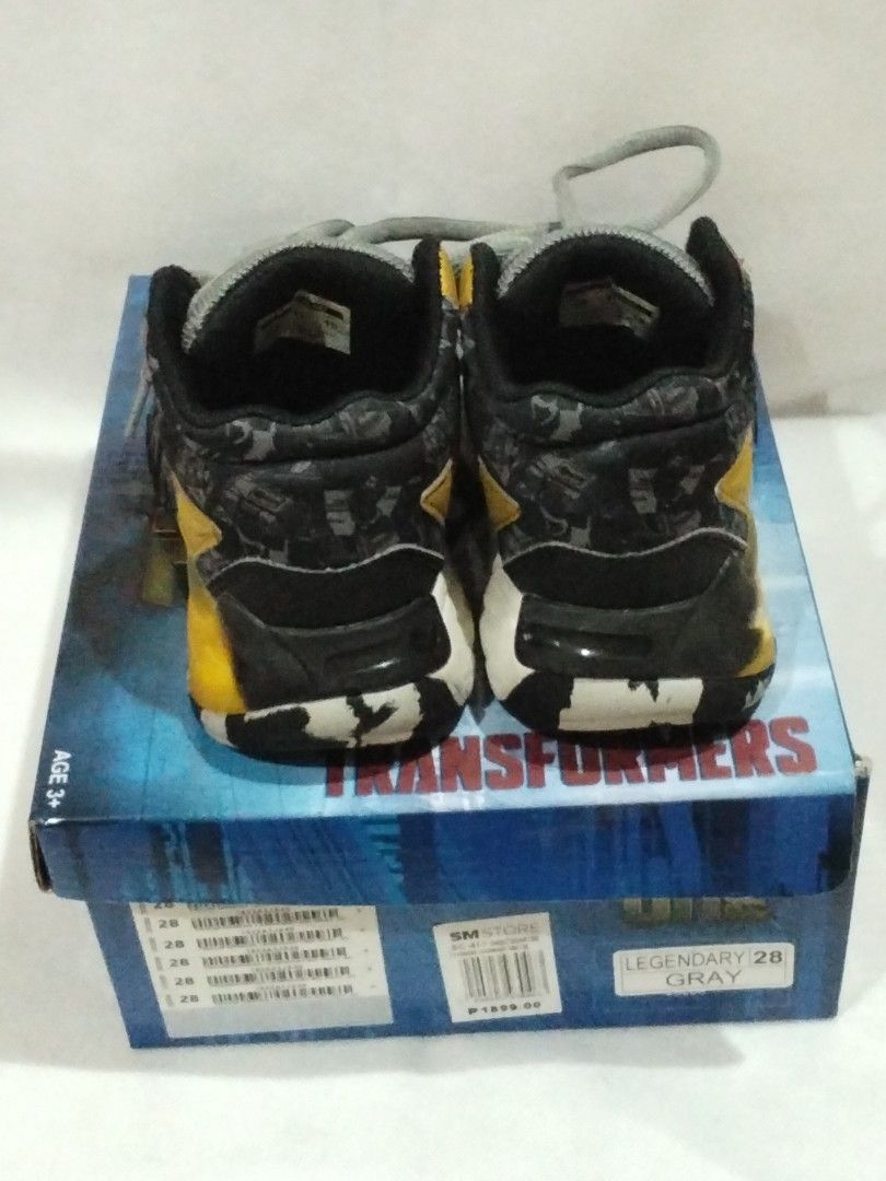 Transformers One Legendary Gray Toddler Sneakers (Category: Babies & Kids Fashion) located in Quezon City. Submitted by robzkinix (Listing ID 1431375104, Image 3). Description: - Transformers One Legendary Gray sneakers - Size 28 (original box included) - Color scheme: Gray, yellow, and black - Condition: Shows wear and tear - Includes scuff marks - Minor crack on one shoe Delivery via Grab/Lalamove/J&T/GGX Payments: Gcash/Maya/Bank transfer.