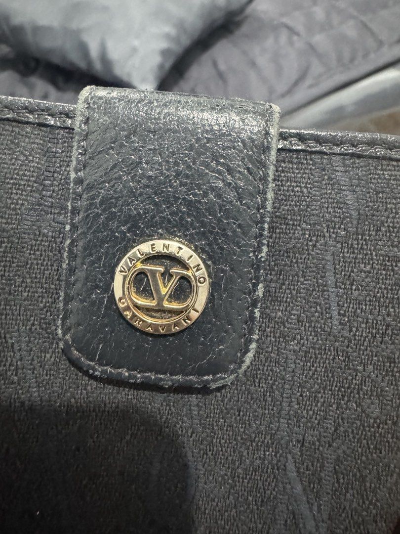 Valentino Garavani Canvas Short Wallet (Category: Luxury Bags & Wallets) located in Quezon City. Submitted by legallyyours02 (Listing ID 1431303678, Image 3). Description: In very good condition Minimal rubs sa edges No tears sa canvas and clean po Leather in excellent condition Lots of compartment Lightweight and compact.