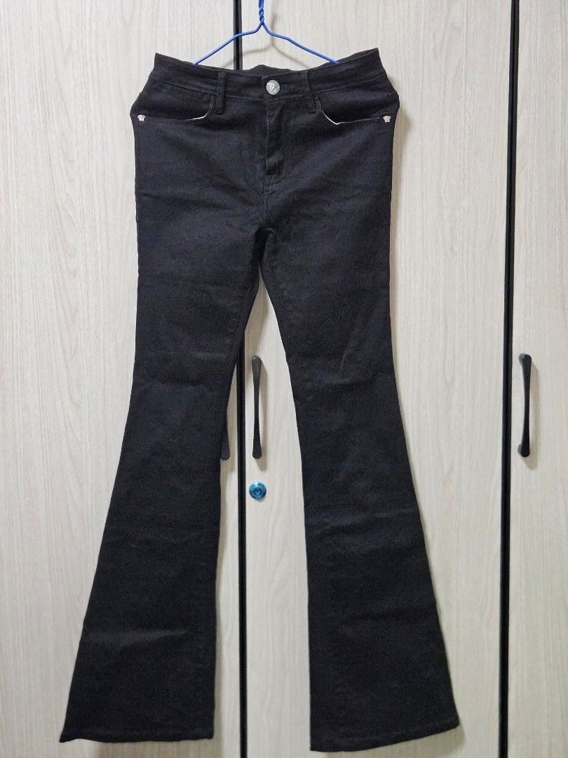 Versace Medusa Black Flared Pants (Category: Jeans) located in Candon. Submitted by itssummer08 (Listing ID 1431195123, Image 1). Description: Like new Condition Bigay lang ng Cousin, no tarnish sa mga accesories nya like yung emblem🙂 Item is stretchable, true black in actual!💯 size 26 waist S-M Women inseam- 30in overall length - 40in bottom opening- 9.5in Not faded. *NGA *NGA *NGA.