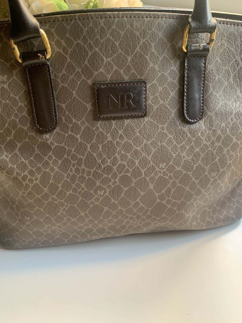 Decluttering: Nina Ricci Classic Handbag (Category: Shoulder Bags) located in Pasig City. Submitted by howsofpreloved (Listing ID 1431274802, Image 3). Description: Vintage Structured Handbag – Classic Brown Pattern | Elegant Daily Bag ⚠️ IMPORTANT – PLEASE READ 💬 For any questions or clarifications, feel free to send a message before placing an offer. 💰 Payment is expected within after the offer is accepted. Failure to complete payment within 