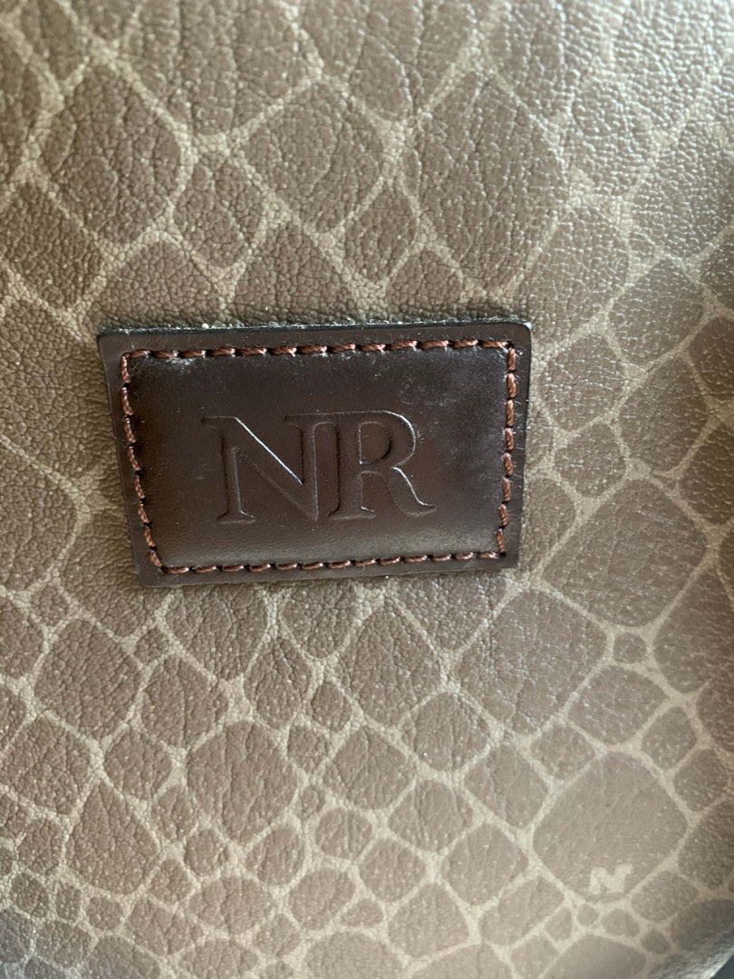 Decluttering: Nina Ricci Classic Handbag (Category: Shoulder Bags) located in Pasig City. Submitted by howsofpreloved (Listing ID 1431274802, Image 2). Description: Vintage Structured Handbag – Classic Brown Pattern | Elegant Daily Bag ⚠️ IMPORTANT – PLEASE READ 💬 For any questions or clarifications, feel free to send a message before placing an offer. 💰 Payment is expected within after the offer is accepted. Failure to complete payment within 