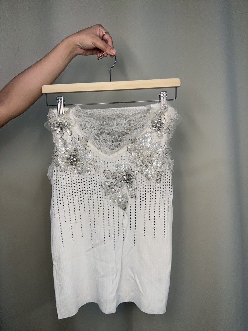 White Embellished Top with Lace Details (Category: Sleeveless) located in Manila. Submitted by rfibe (Listing ID 1431363526, Image 1). Description: - White top with intricate embellishments - Delicate lace detailing - Sparkling accents on the front - Beautiful lace panel on the back - Ideal for special occasions - Flattering fit - Comfortable fabric.