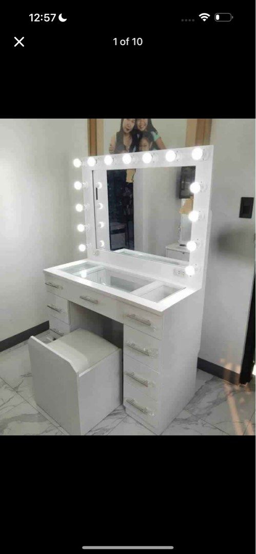 White Vanity Table with Lights (Category: Tables & Sets) located in Marikina City. Submitted by madeokie21 (Listing ID 1431348510, Image 1). Description: -second hand -alm 6 months old -rfs: changing into small one -with bulbs na po -no dents -orig price 11,500 - Elegant white vanity table - Large mirror with built-in lights - Multiple drawers for storage - Glass-covered top - Includes matching white stool - Perfect for makeup and getting ready -