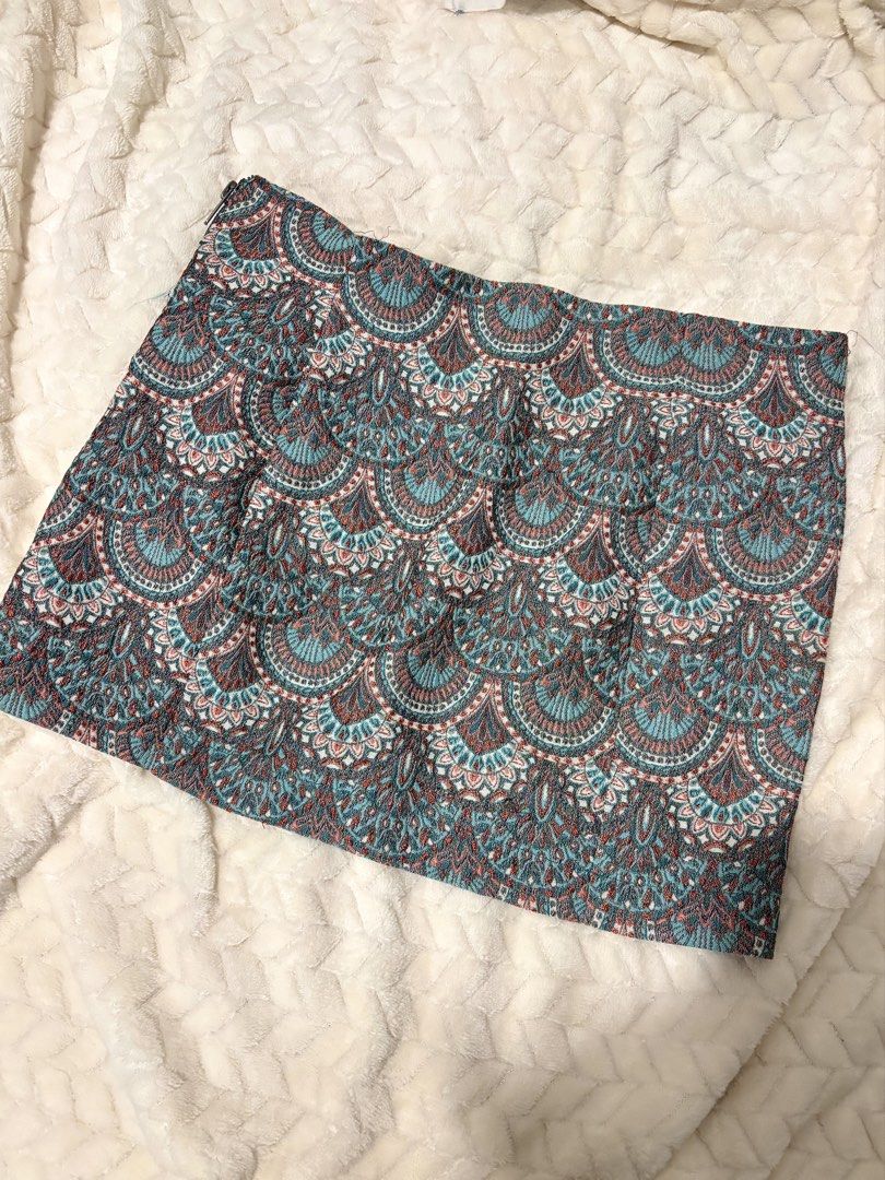 Zara Trafaluc Printed Boho Skirt (Category: Skirts) located in Taguig. Submitted by hisandhers16 (Listing ID 1431337062, Image 2). Description: Good as new. Barely used. Tag say large but fits medium to large, size 30-31. Bought for around 1.5k. Coachella fit, boho skirt. - Zara Trafaluc skirt - Unique printed design - Features teal lining - Zipper closure - Textured fabric - Color palette: Teal, brown, white - Made in Romania.