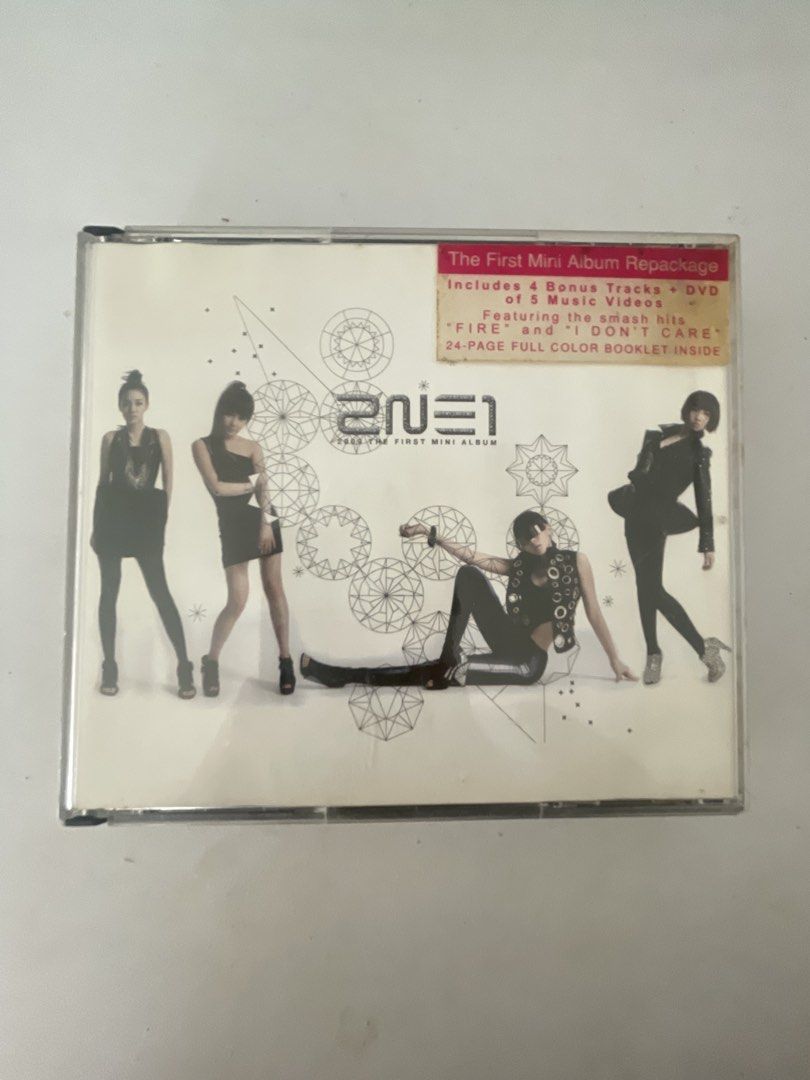 2NE1 - The First Mini Album Repackage (Category: CDs & DVDs) located in Rizal. Submitted by hannapamm (Listing ID 1431481749, Image 1). Description: - 2NE1 The First Mini Album Repackage - Includes 4 bonus tracks - Features a DVD with 5 music videos - Includes the hit songs "FIRE" and "I DON'T CARE" - Comes with a 24-page full-color booklet.
