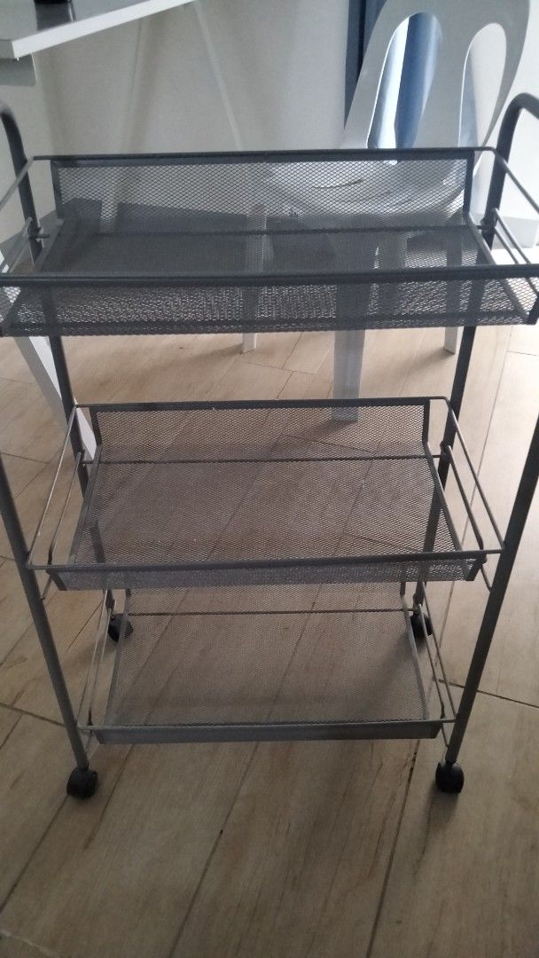 3-Tier Metal Storage Cart with Wheels (Category: Storage Boxes & Baskets) located in Taguig. Submitted by royalmoon.7da2a3 (Listing ID 1431472720, Image 1). Description: - 3-tier metal storage cart - Three mesh shelves - Sturdy frame - Easy mobility with wheels - Ideal for kitchens, bathrooms, and more - Neutral gray color.
