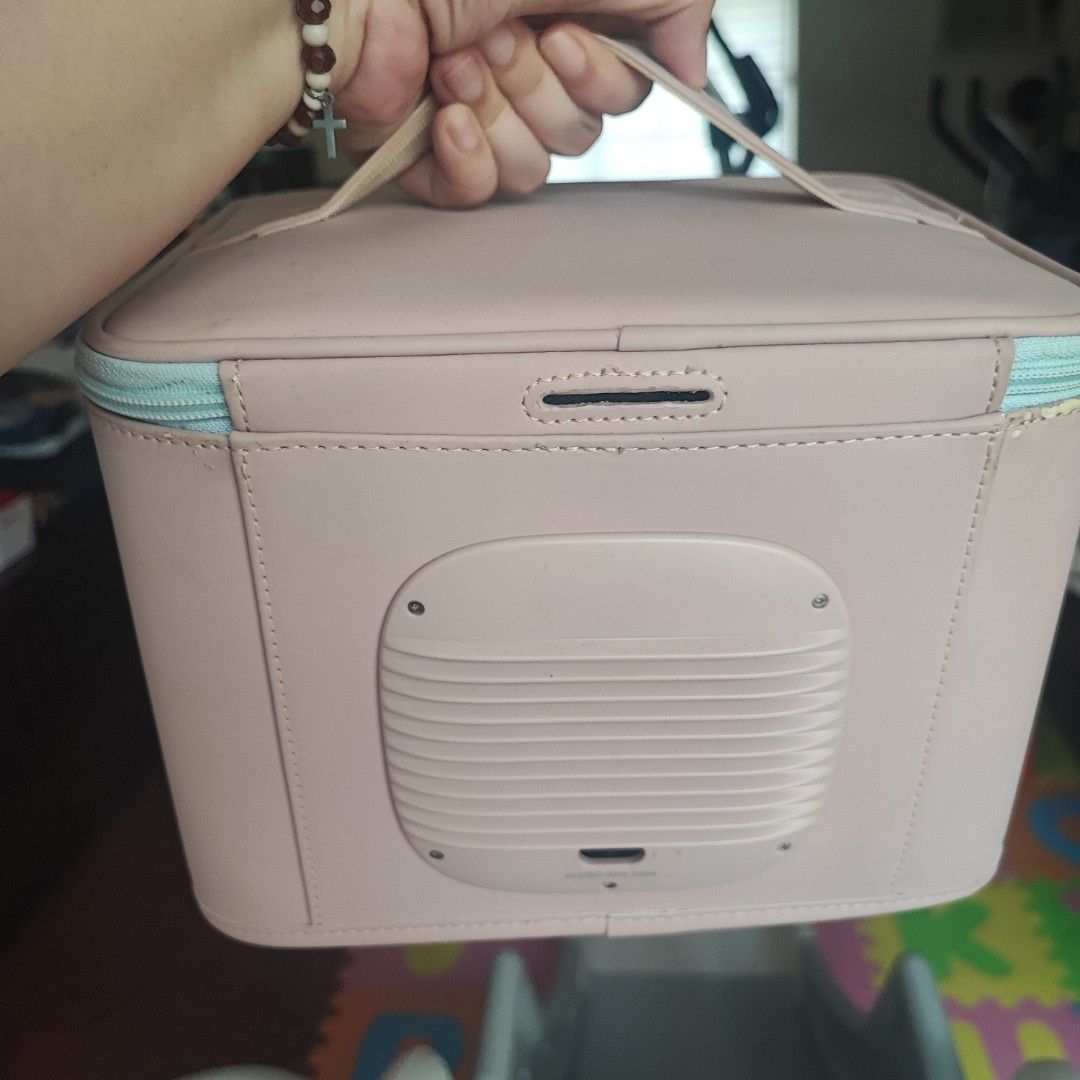 59S LED UV Sterilizer Box (Category: Breastfeeding & Bottle Feeding) located in Mandaluyong City. Submitted by karisse628 (Listing ID 1431429935, Image 3). Description: - 59S LED UV sterilizer box - Easy to carry with a handle - Secure zipper closure - Includes a rack and small accessory - Comes with a power cord - Stylish pink design with a light blue zipper.