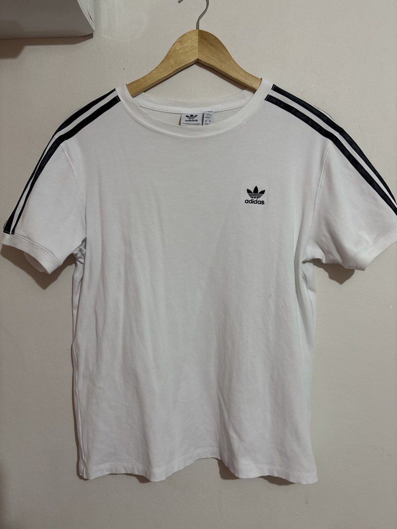 Adidas 3-Stripes T-Shirt - White (Category: Shirts) located in Malolos. Submitted by bmnld (Listing ID 1431425071, Image 1). Description: - Adidas t-shirt - Color: White with black stripes - Features the Adidas trefoil logo - Size: L - Made in China.