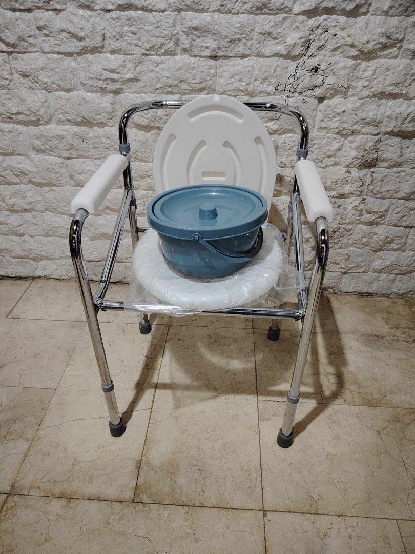Adjustable Commode Chair with Bucket (Category: Medical Supplies & Tools) located in Manila. Submitted by rosel2001 (Listing ID 1431416644, Image 2). Description: - Sturdy chrome-plated steel frame - Includes armrests for added support - Features a removable bucket for easy cleaning - Durable white plastic seat - Adjustable for user comfort - Designed for individuals needing toileting assistance.