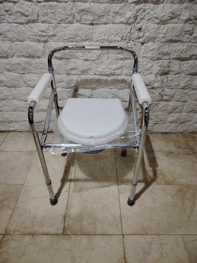 Adjustable Commode Chair with Bucket (Category: Medical Supplies & Tools) located in Manila. Submitted by rosel2001 (Listing ID 1431416644, Image 3). Description: - Sturdy chrome-plated steel frame - Includes armrests for added support - Features a removable bucket for easy cleaning - Durable white plastic seat - Adjustable for user comfort - Designed for individuals needing toileting assistance.
