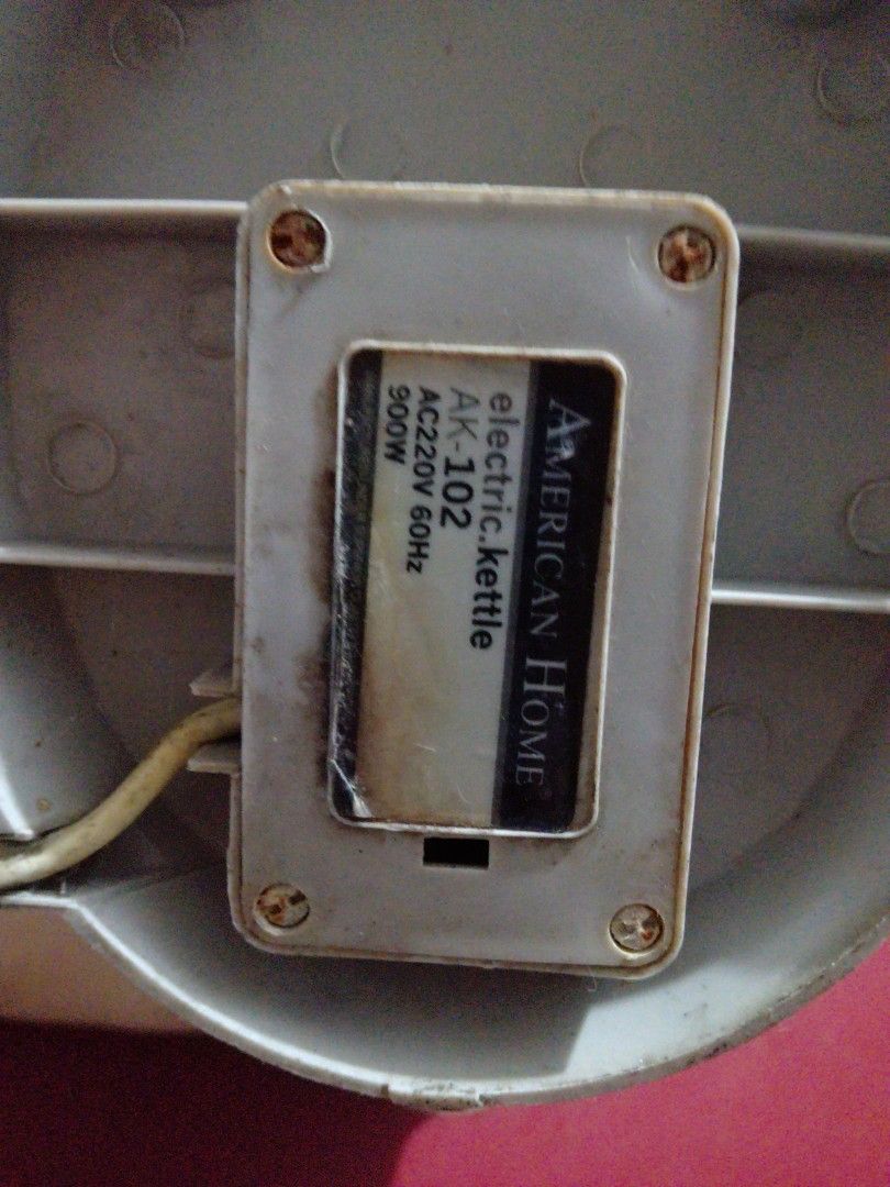 American Home Electric Kettle AK-102 (Category: Kettles & Airpots) located in Manila. Submitted by pat_buynsell_declutter (Listing ID 1431549601, Image 3). Description: - Used beige electric kettle - Features a convenient handle - Includes a visible water level indicator - Shows the heating element - Comes with a power cord - Ideal for boiling water for various uses.