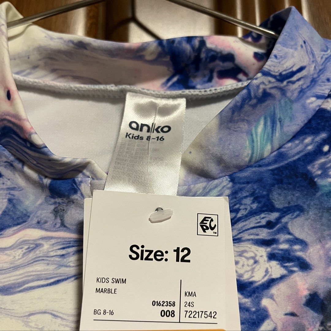 Anko Swim Marble Rashguard Swimsuit (Category: Rash guard) located in Santa Rosa. Submitted by blousa.ph (Listing ID 1431518862, Image 3). Description: Anko Swim Marble Rashguard Swimsuit - Size 12 (fits xs to s) - Eye-catching marble pattern (blue, purple, white) - Long sleeves for sun protection - Convenient zip-up front - Ideal for swimming and beach activities Original from Australia still with tag. .