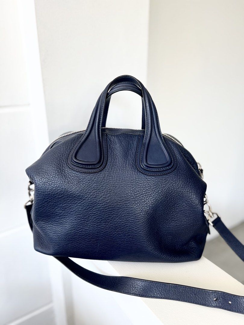Authentic preloved Givenchy Blue medium nightingale bag (Category: Luxury Bags & Wallets) located in San Pablo. Submitted by misskittyph (Listing ID 1431488423, Image 2). Description: Givenchy Navy Blue medium nightingale 2 way Bag SHW ▪️35k only Rating 9/10 With detachable long strap Generic dustbag only Layaway options available 💯Guaranteed authentic or your money back .