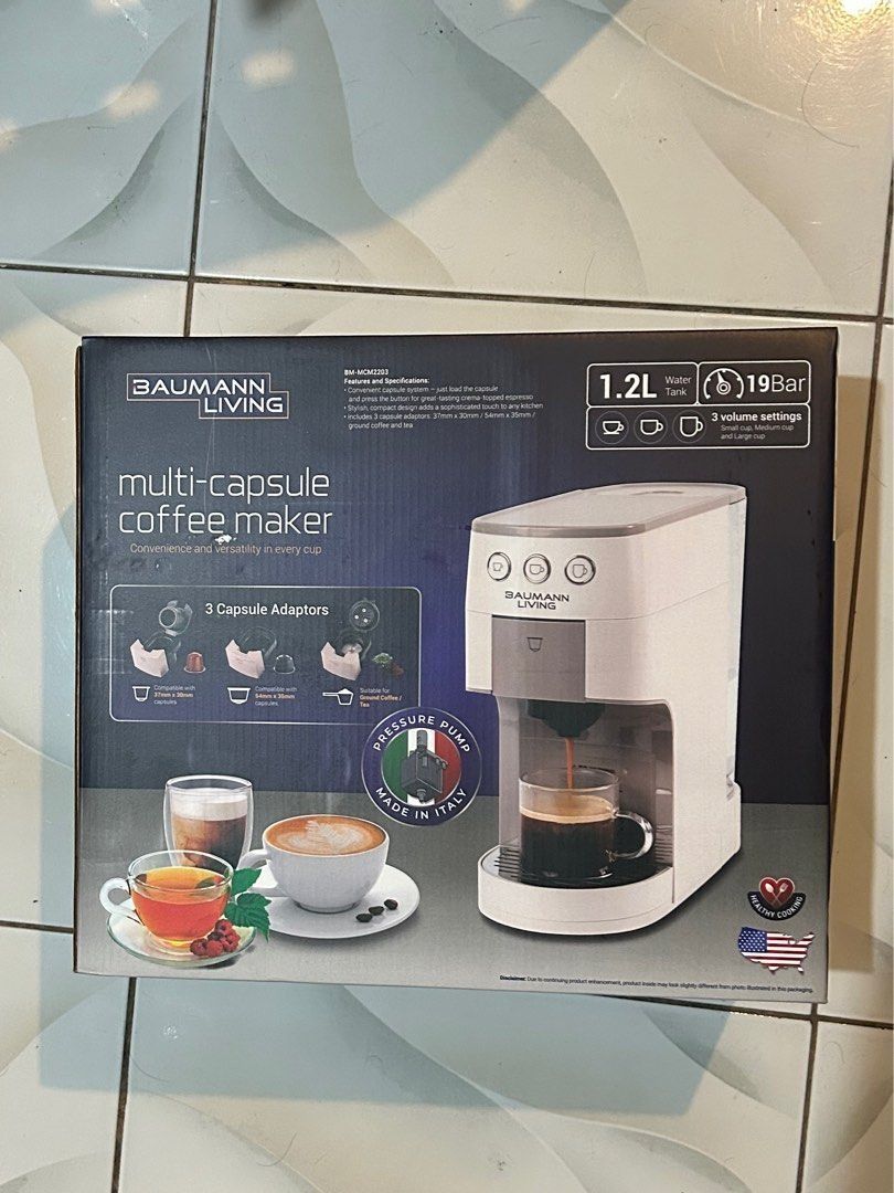 Baumann Living Multi-Capsule Coffee Maker (Category: Coffee Machines & Makers) located in Manila. Submitted by leighb1201 (Listing ID 1431391696, Image 2). Description: - Baumann Living Multi-Capsule Coffee Maker - 1.2L Water Tank - 19 Bar Pressure Pump - 3 Volume Settings - Includes 3 Capsule Adaptors - Compatible with Nespresso, Dolce Gusto, and Ground Coffee - Made in Italy.