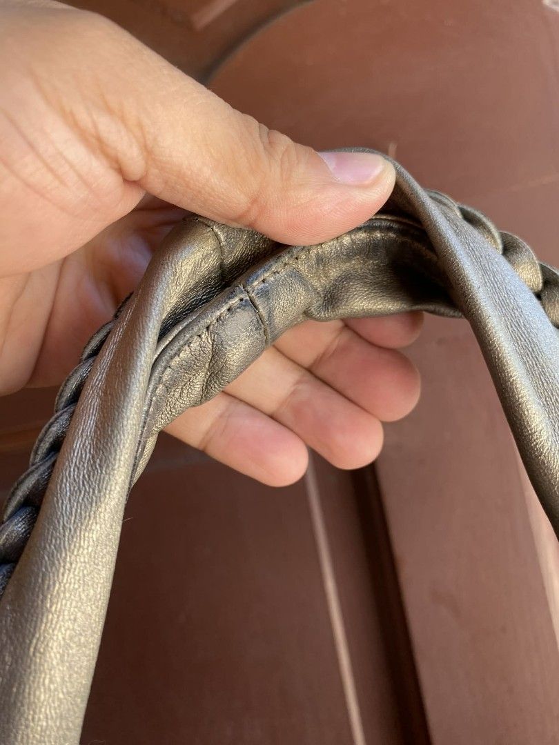 BOTTEGA HOBO STYLE BAG (Category: Tote Bags) located in Caloocan City. Submitted by thon0806 (Listing ID 1431408723, Image 3). Description: - Peaks Peak handbag - Woven design - Braided handle - Fabric lining with brand tag - Silver-grey color - Minor stain on handle - minimal aign of used - minor fading sa handle .