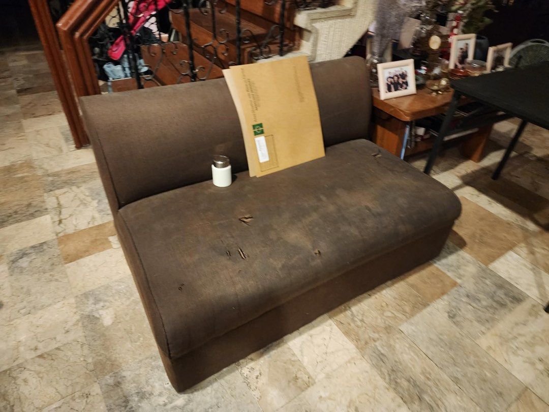 Brown Chaise Lounge Sofa (Category: Sofas) located in Muntinlupa City. Submitted by alyssagill (Listing ID 1431468259, Image 2). Description: - Brown chaise lounge sofa, wrapped in plastic. - Features a curved back and long seat. - Includes a separate brown sofa..