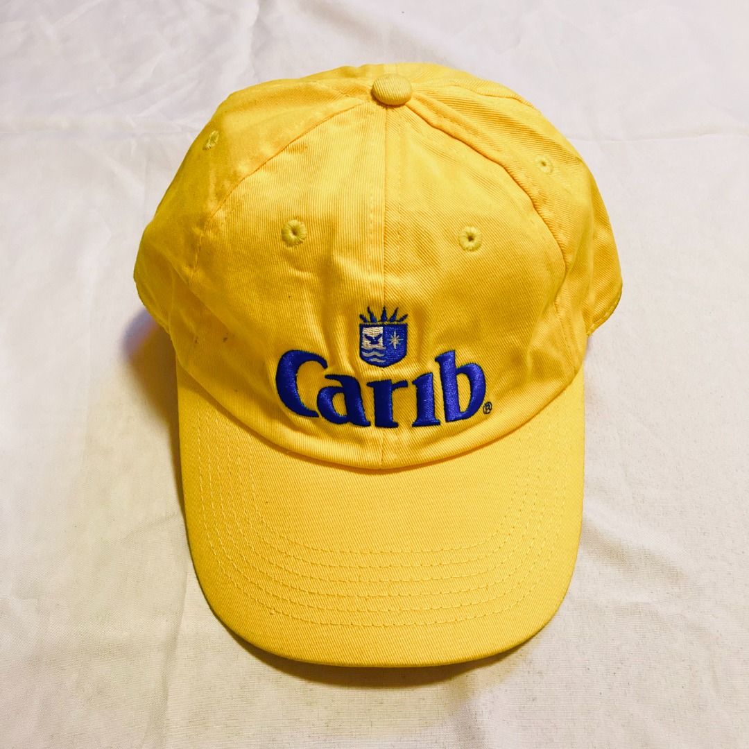 Carib Lager beer baseball cap (Category: Caps & Hats) located in Rizal. Submitted by sensorix___ (Listing ID 1431440305, Image 1). Description: This vintage 1990s yellow baseball cap features the embroidered logo for Carib Lager beer OSFA - One size fits all if you interested please just hit the message..