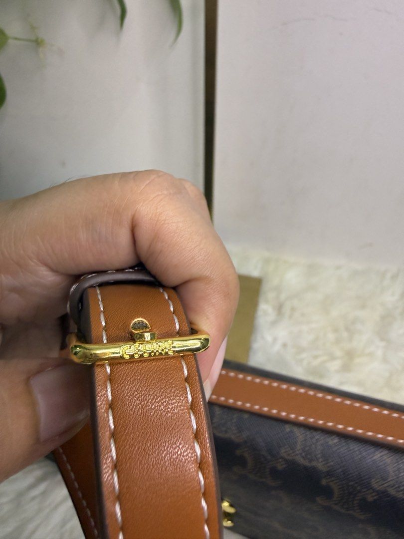 Celine Triomphe Shoulder Bag (Category: Luxury Bags & Wallets) located in Consolacion. Submitted by naome1. (Listing ID 1431482672, Image 3). Description: - Celine Triomphe shoulder bag - Iconic Triomphe clasp - Brown monogram pattern - Brown leather strap - Gold-tone hardware - Brown leather interior - Celine Paris logo - Serial number: SP2175.