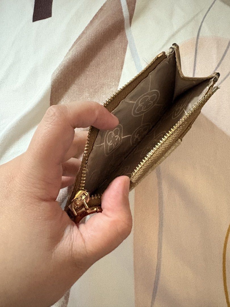 CLN cardholder and purse (Category: Luxury Bags & Wallets) located in Manila. Submitted by alejaoe (Listing ID 1431388636, Image 3). Description: Elevate your daily essentials with this stunning CLN monogram cardholder. Designed for the woman on the go who loves a mix of neutral tones and gold hardware. Compact enough for your smallest mini-bag, but stylish enough to carry on its own. • Color: Sand/Beige with Gold Accents • Features: Multiple car