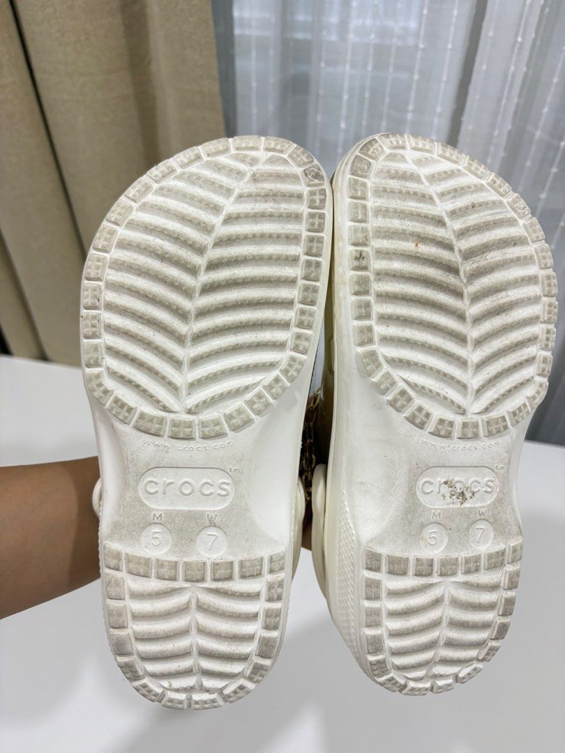 Crocs Sandals with Chain and Embellishments c7 (Category: Flats & Sandals) located in Manila. Submitted by analyntorr16083 (Listing ID 1431481414, Image 3). Description: - Transparent upper and white base Crocs sandals - Features decorative chains, rhinestones, and heart accents - Comfortable design, ideal for casual use - Some wear on soles.
