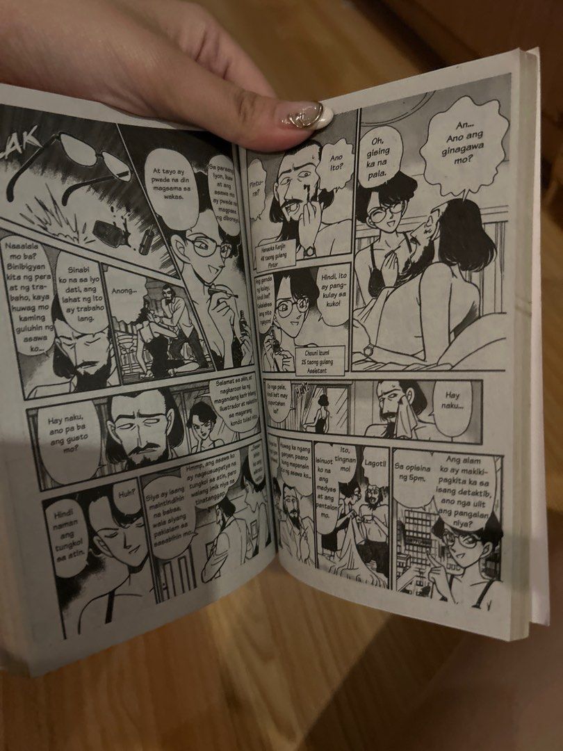 Detective Conan Volume 13 (Category: Comics & Manga) located in Quezon City. Submitted by bmswardrobe (Listing ID 1431528312, Image 3). Description: - Detective Conan Volume 13 manga - Features Detective Conan on the cover - Contains illustrations and text in Filipino - Published by Jline Comics Center - Includes barcode and keyhole design on the back cover - Ideal for Detective Conan fans.