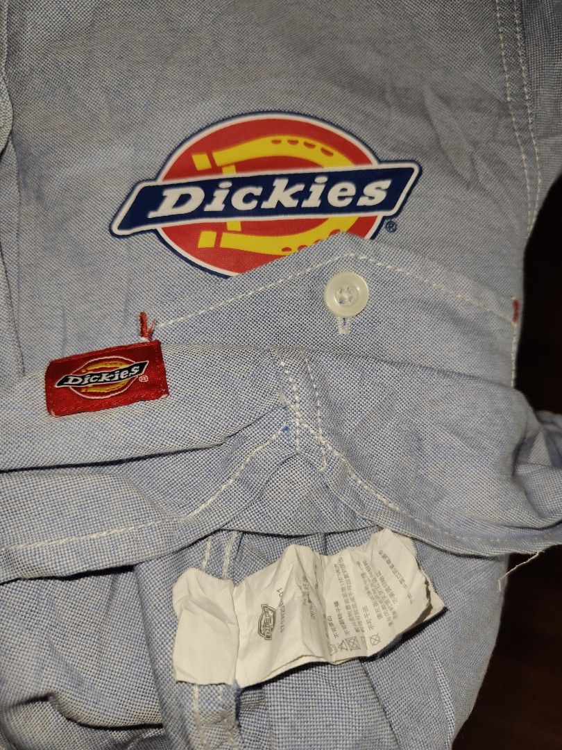 Dickies Button-Down Shirt (Category: Tshirts & Polo Shirts ) located in Kabankalan. Submitted by stylesavy (Listing ID 1431419931, Image 3). Description: - Light blue softdenim Dickies button-down polo LS - Size: Large on tag - Features Dickies logo on chest pocket - Small Dickies logo on sleeve - Button-down collar - Single chest pocket - Measurements: W18 x L24.
