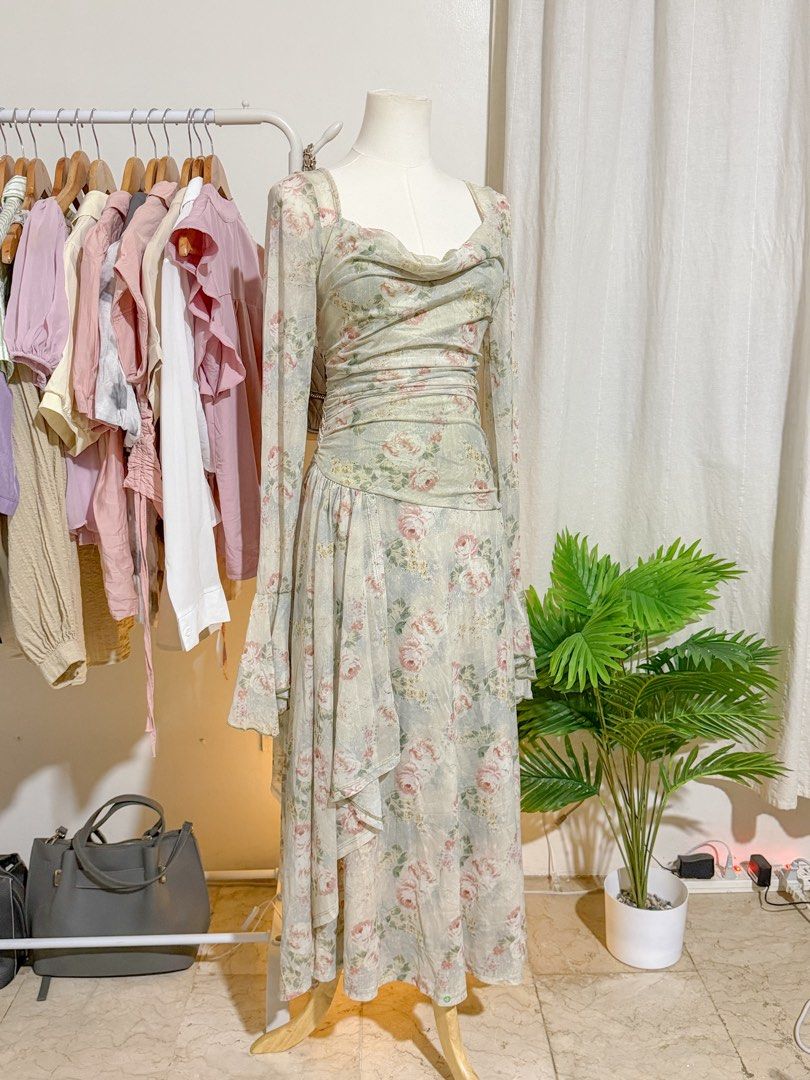 Floral Print Dress (Category: Dresses) located in Rizal. Submitted by ktrncdln (Listing ID 1431438458, Image 1). Description: - Elegant floral print dress - Cowl neckline - Long sleeves - Ruched bodice - Flowing, layered skirt - Lightweight and semi-sheer fabric - Perfect for special occasions or romantic wear.