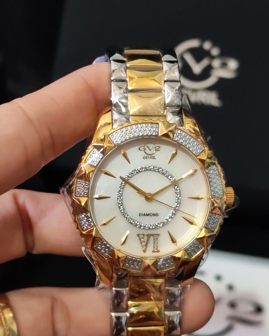 Gevril Venice Diamond Watch (Category: Luxury Watches) located in Manila. Submitted by jewfindshop (Listing ID 1431453418, Image 2). Description: - Gevril Venice watch - Diamond-studded bezel and dial - Two-tone gold and silver bracelet - Includes original box, instruction manual, and warranty cards - White dial with gold accents - Roman numeral hour markers - Clasp visible in images.