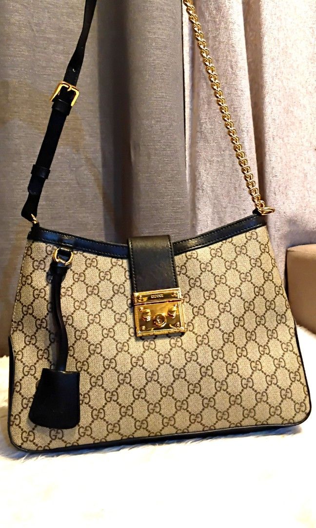 Gucci Supreme Monogram shoulder bag (Category: Luxury Bags & Wallets) located in San Juan City. Submitted by cheryl20624 (Listing ID 1431556390, Image 2). Description: Gucci Monogram Medium Padlock Shoulder Bag Black good as new fold over flap set of key sued lining,adjustable leather and chain link,logo engraved goldtone hardware,push lock pastening and comes with dustbag#fyp #likenew #gucci #shoulderbag.