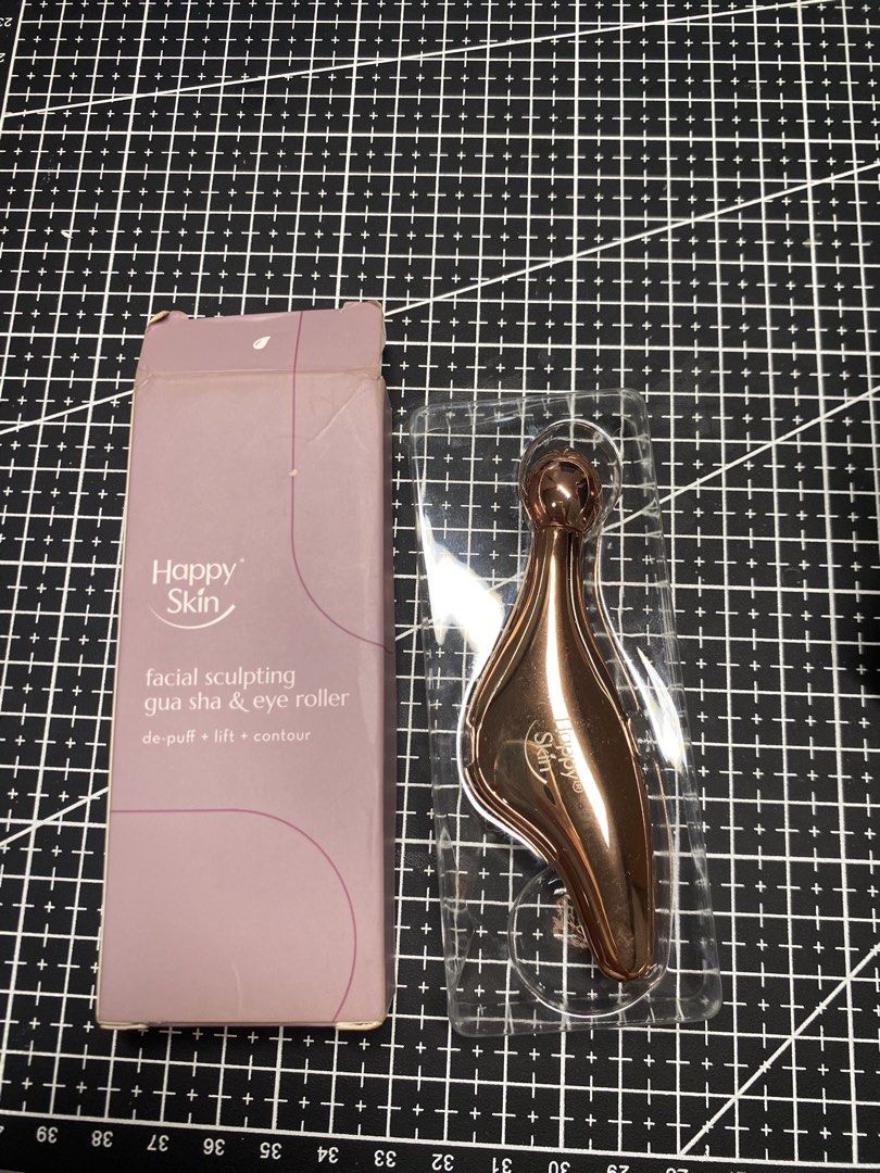 Happy Skin Gua Sha & Eye Roller (Category: Face Care) located in Baguio. Submitted by thriftcornerbygelle (Listing ID 1431413241, Image 1). Description: - Used less than 5 times - Lady Owned - Happy Skin Facial Sculpting Gua Sha & Eye Roller - Designed to de-puff, lift, and contour the face. - Made of durable, hypoallergenic Zamac alloy. - Use with serum, moisturizer, or facial oil. - Gently use the eye roller around the eye area..