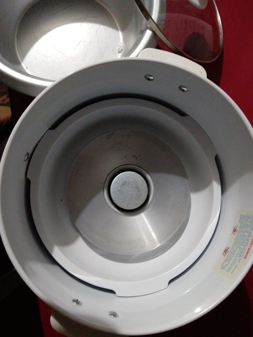 Ikon Electric Rice Cooker IK15-98 2A (Category: Cookers) located in Manila. Submitted by pat_buynsell_declutter (Listing ID 1431549901, Image 2). Description: - Ikon electric rice cooker - Automatic cooking and keep warm functions - Detachable steam vent - Non-stick inner pot - Includes: Glass lid, power cord, and user manual - Color: White with silver inner pot - Model: IK15-98 2A.