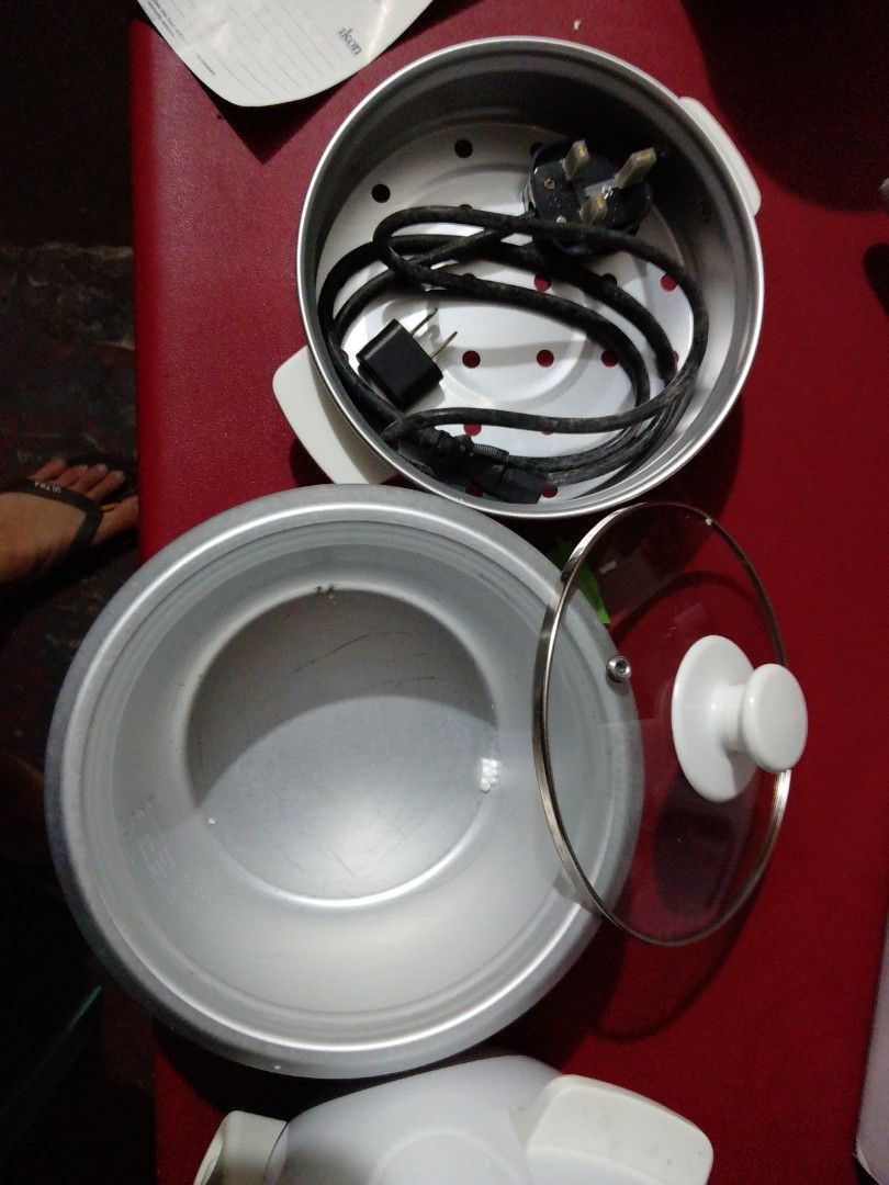 Ikon Electric Rice Cooker IK15-98 2A (Category: Cookers) located in Manila. Submitted by pat_buynsell_declutter (Listing ID 1431549901, Image 3). Description: - Ikon electric rice cooker - Automatic cooking and keep warm functions - Detachable steam vent - Non-stick inner pot - Includes: Glass lid, power cord, and user manual - Color: White with silver inner pot - Model: IK15-98 2A.