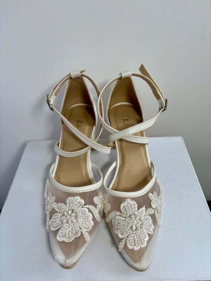 Kara wedding shoes (Category: Heels) located in Amadeo. Submitted by miyaval (Listing ID 1431450963, Image 2). Description: Wedding shoes by Kara Zapatos Bridal -Ivory white -3D floral lace appliques -Size 6 -2” block heels -Used during wedding ceremony Mode of Payment: BDO, BPI, GCash Location: Amadeo, Cavite.