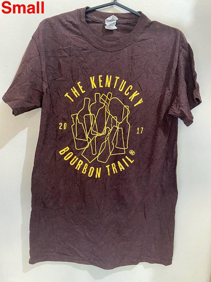 Kentucky Bourbon Trail T-Shirt - Small (Category: Tshirts & Polo Shirts ) located in Bago City. Submitted by piperruy (Listing ID 1431419350, Image 1). Description: - Maroon t-shirt - Features a yellow graphic: "The Kentucky Bourbon Trail" (2017 & 2017) - Size: Small - Made of soft material - Crew neck - Short sleeves.