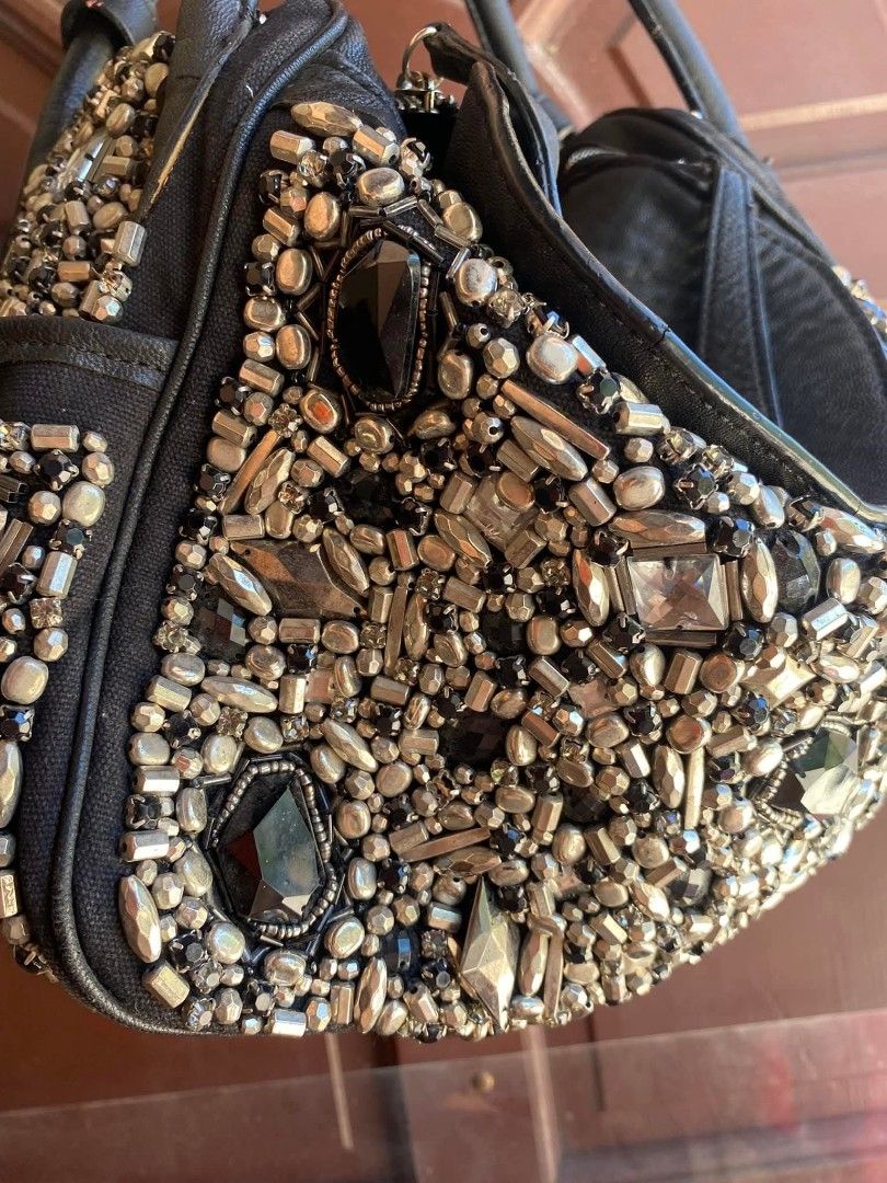 Lindy Black Embellished Handbag (Category: Luxury Bags & Wallets) located in Caloocan City. Submitted by thon0806 (Listing ID 1431407901, Image 2). Description: honest issues: needs cleaning some cracks sa rubber lining ng bag missing one footb slouchy na sya tignan .