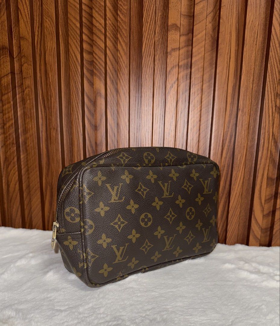 Vintage Louis Vuitton Toiletry Pouch 26 (Category: Luxury Bags & Wallets) located in Subic. Submitted by luxshoppe88 (Listing ID 1431533913, Image 2). Description: Authentic Vintage Louis Vuitton Toiletry Pouch 26 in classic Monogram canvas. Features a zip closure with a gold-tone zipper pull. No code its a vintage piece. The interior is lined with a brown leather. Made in France. The pouch has a spacious interior for storing cosmetics and other 